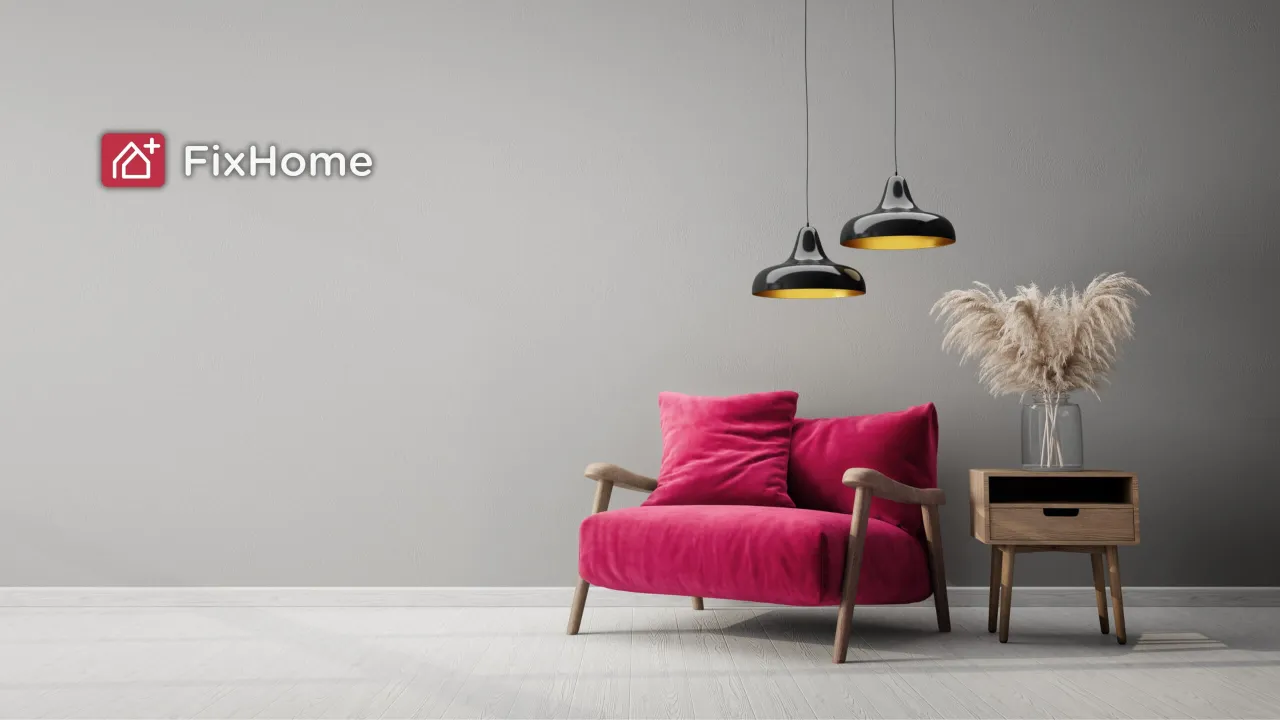 Modern living room with gray walls, red chair, stylish lights