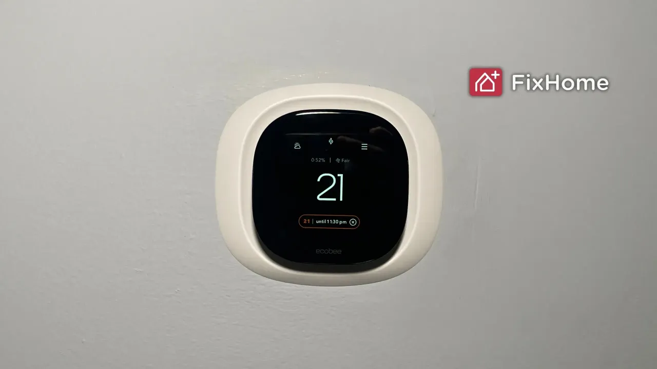 Smart thermostat installing on the white wall