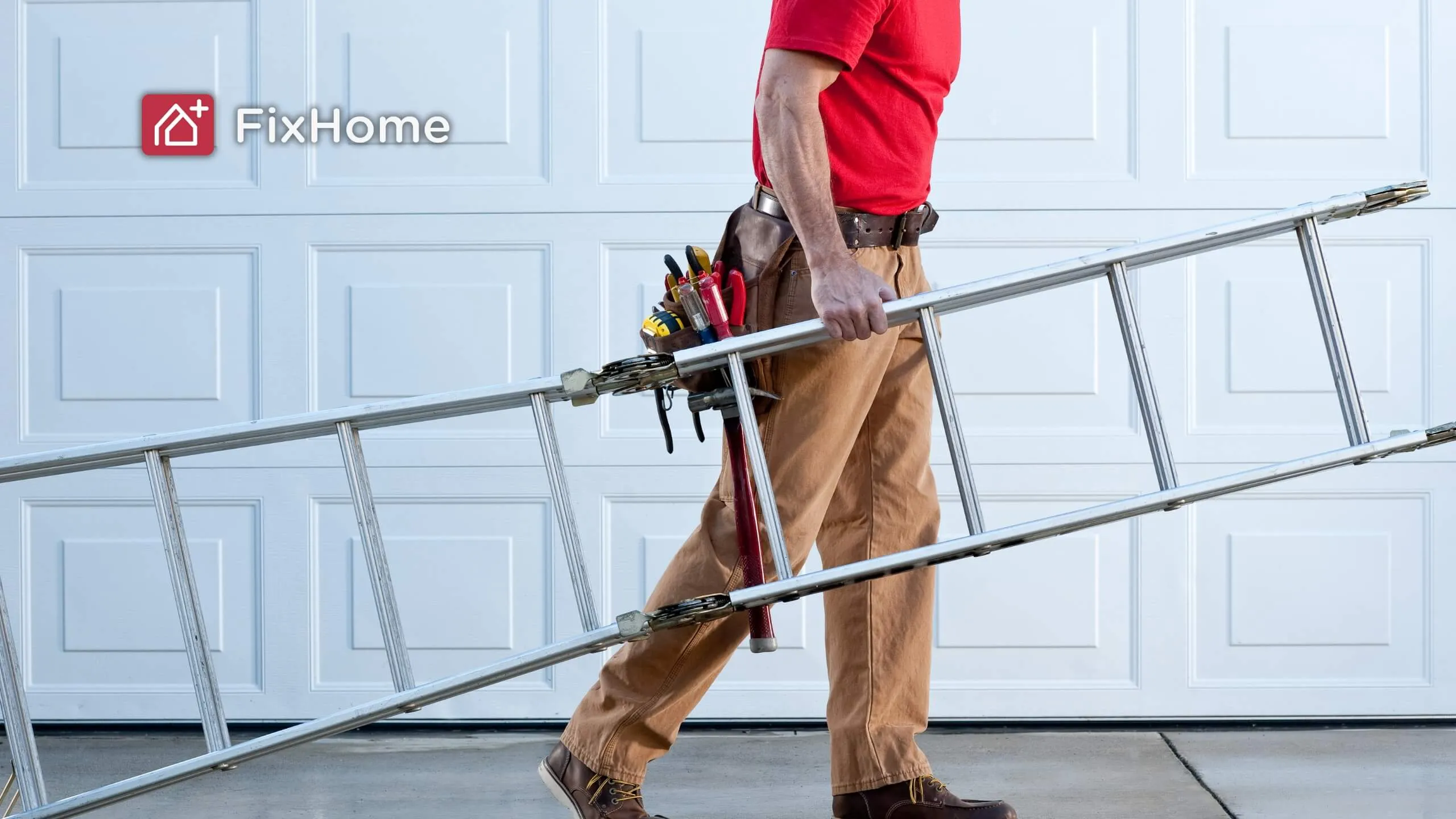 A person in a red shirt carrying a ladder with a tool belt