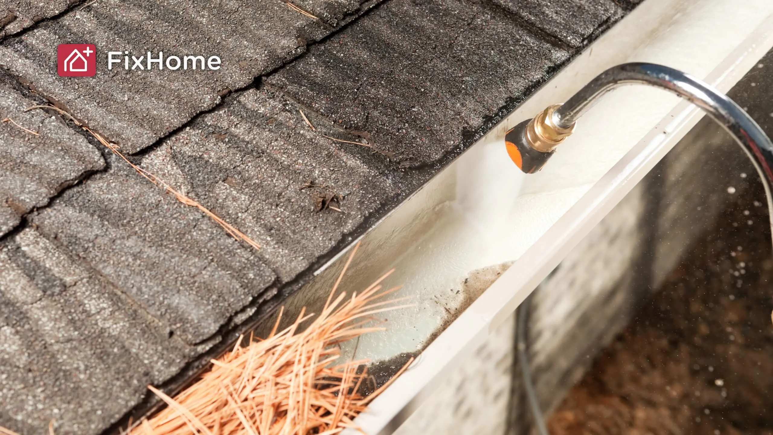 Cleaning gutter with water pressure