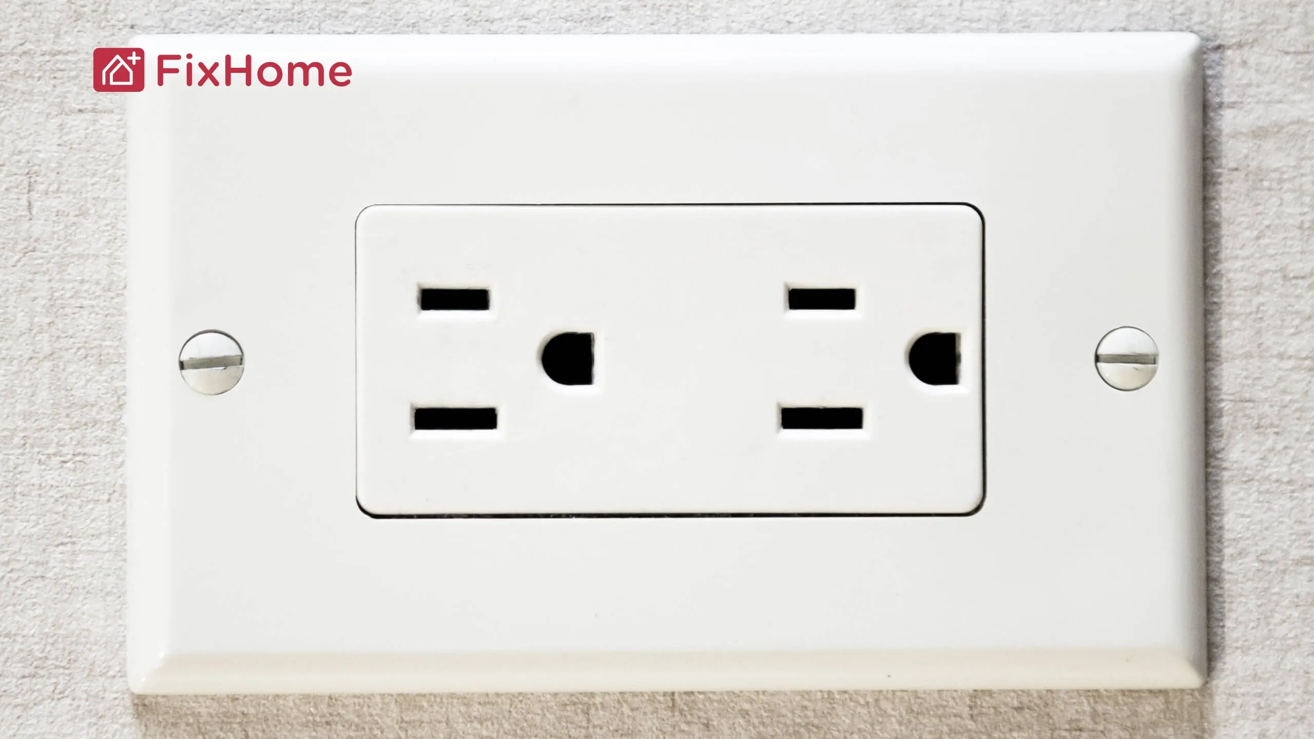 A standard grounded US wall outlet with two slots for plugs, mounted on a white wall