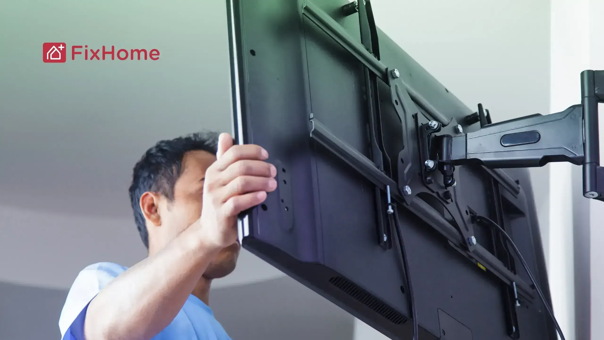 Handyman installing a TV mount