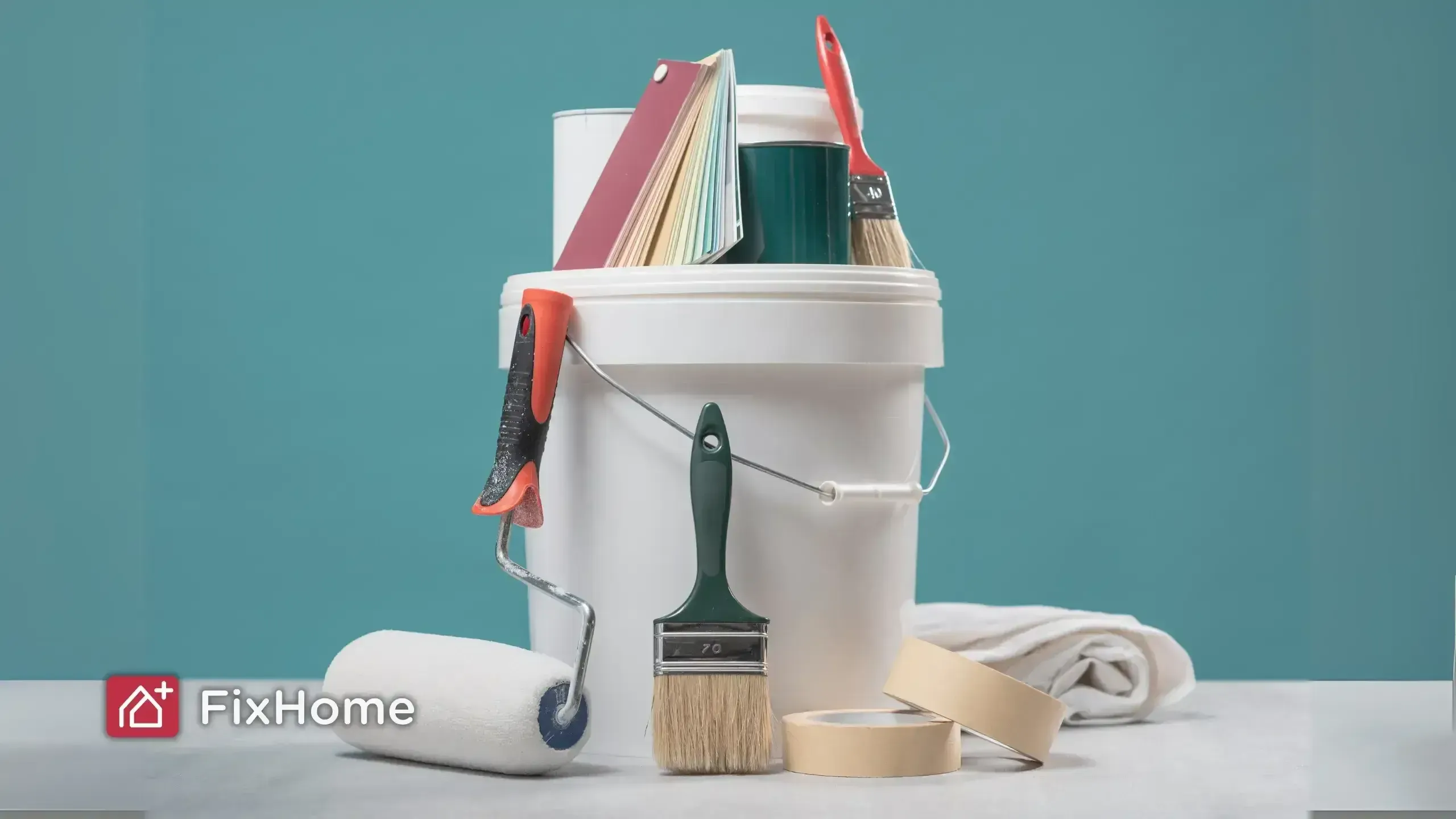 Painting tools including a bucket, roller, and brushes.