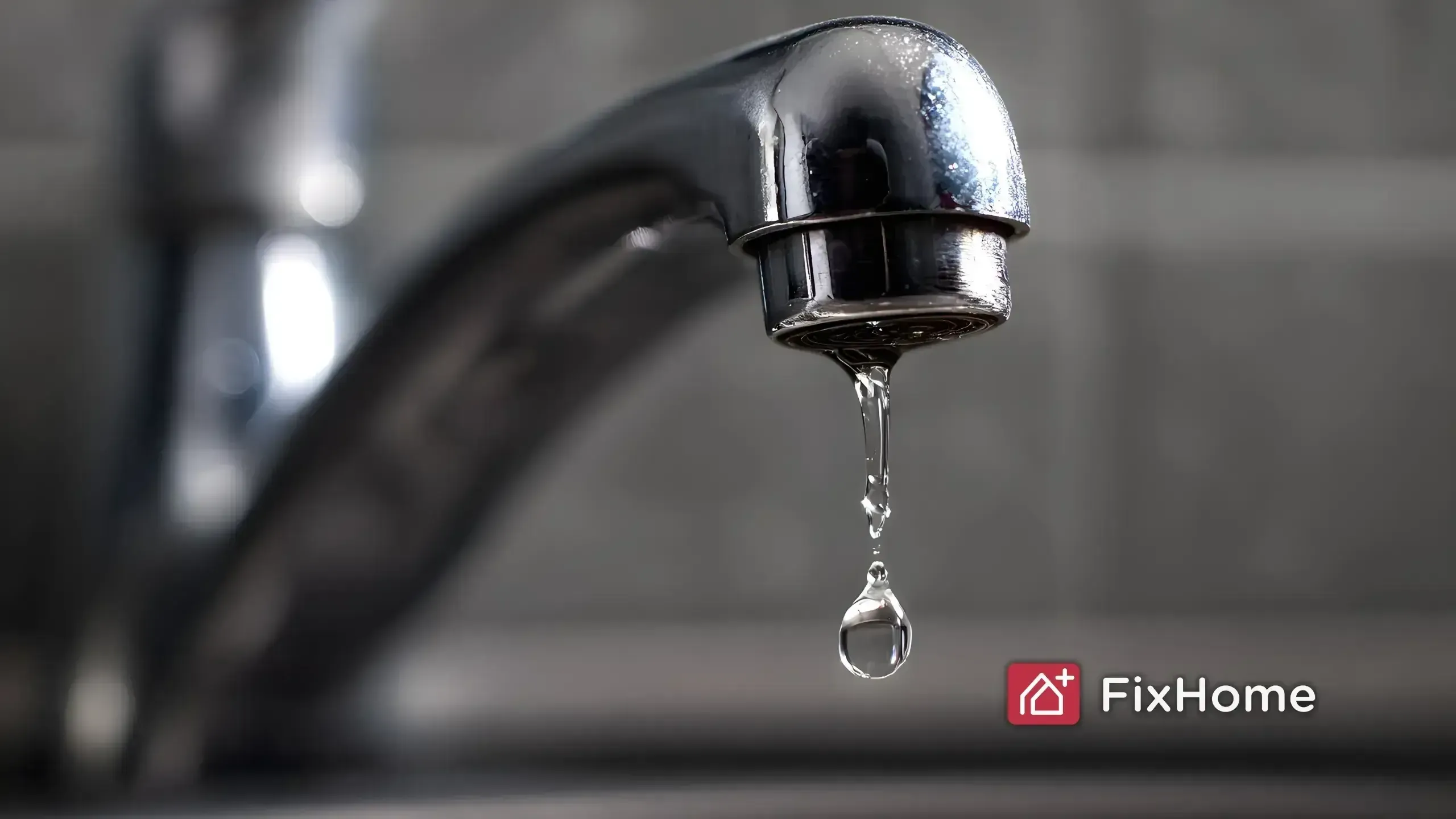 Water Dripping from a Metal Faucet