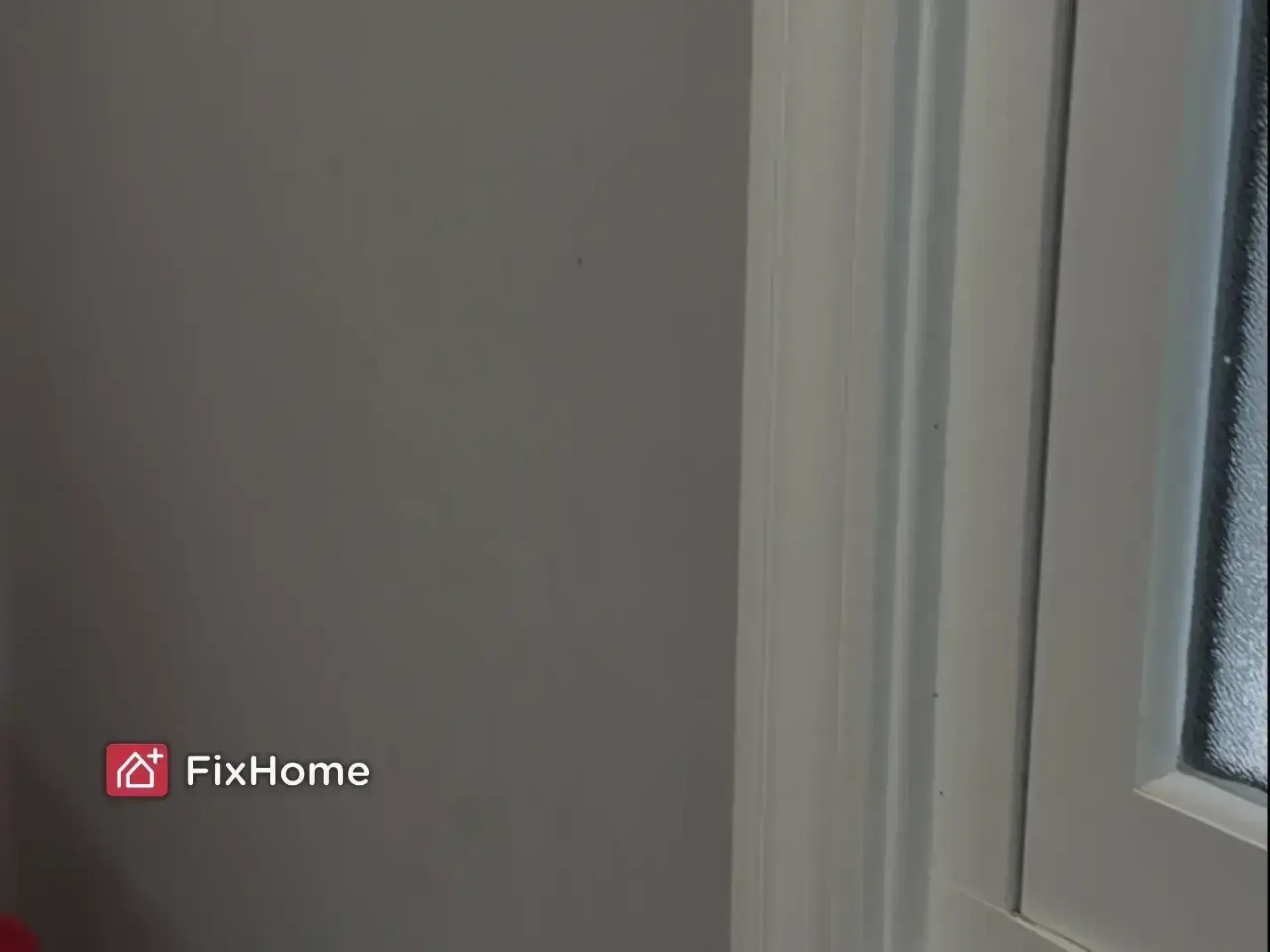 A wall required painting with a small crack, adjacent to a window and white trim