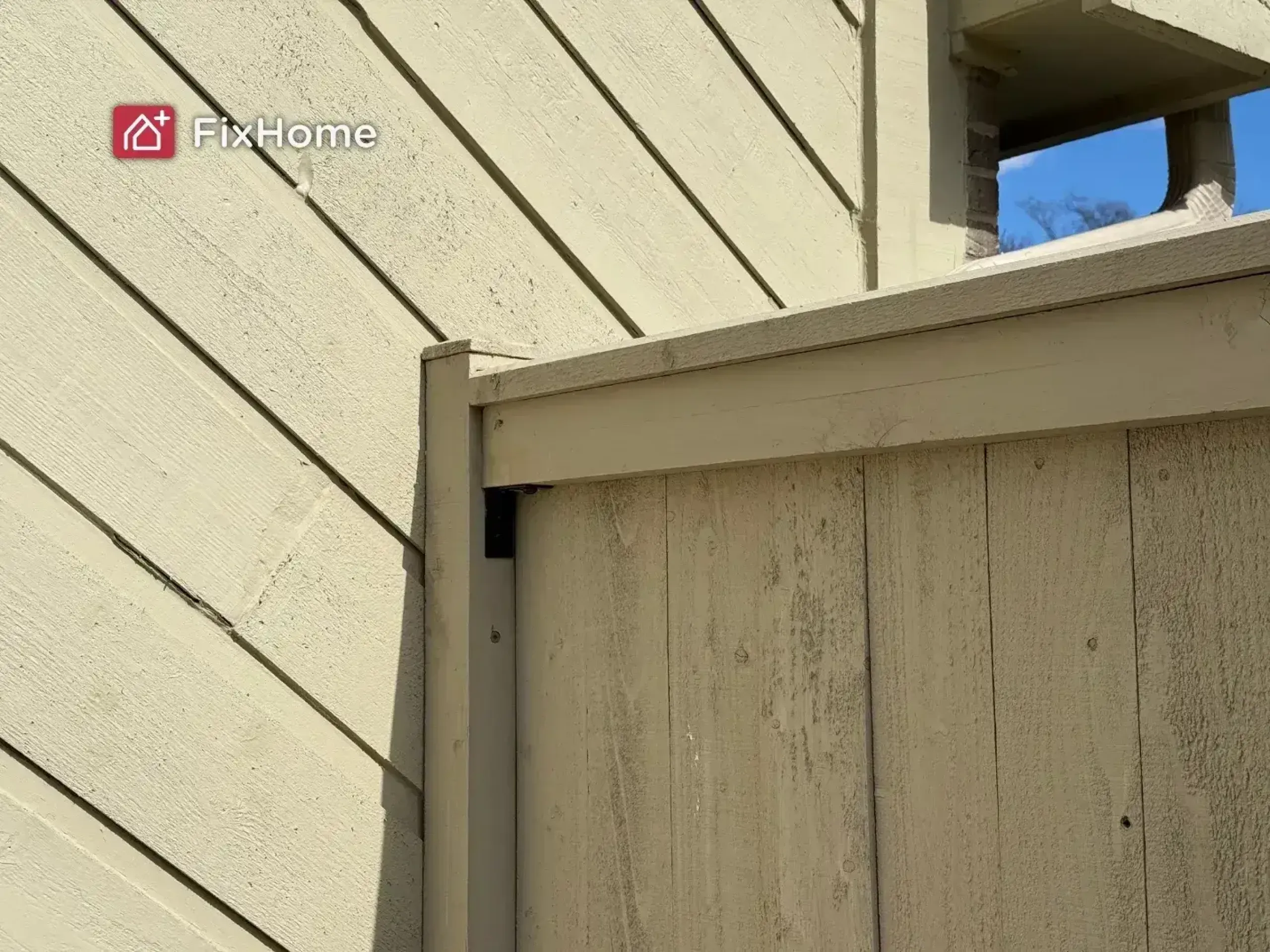 A fixed wooden fence next to a house in Hawthorn Woods, IL