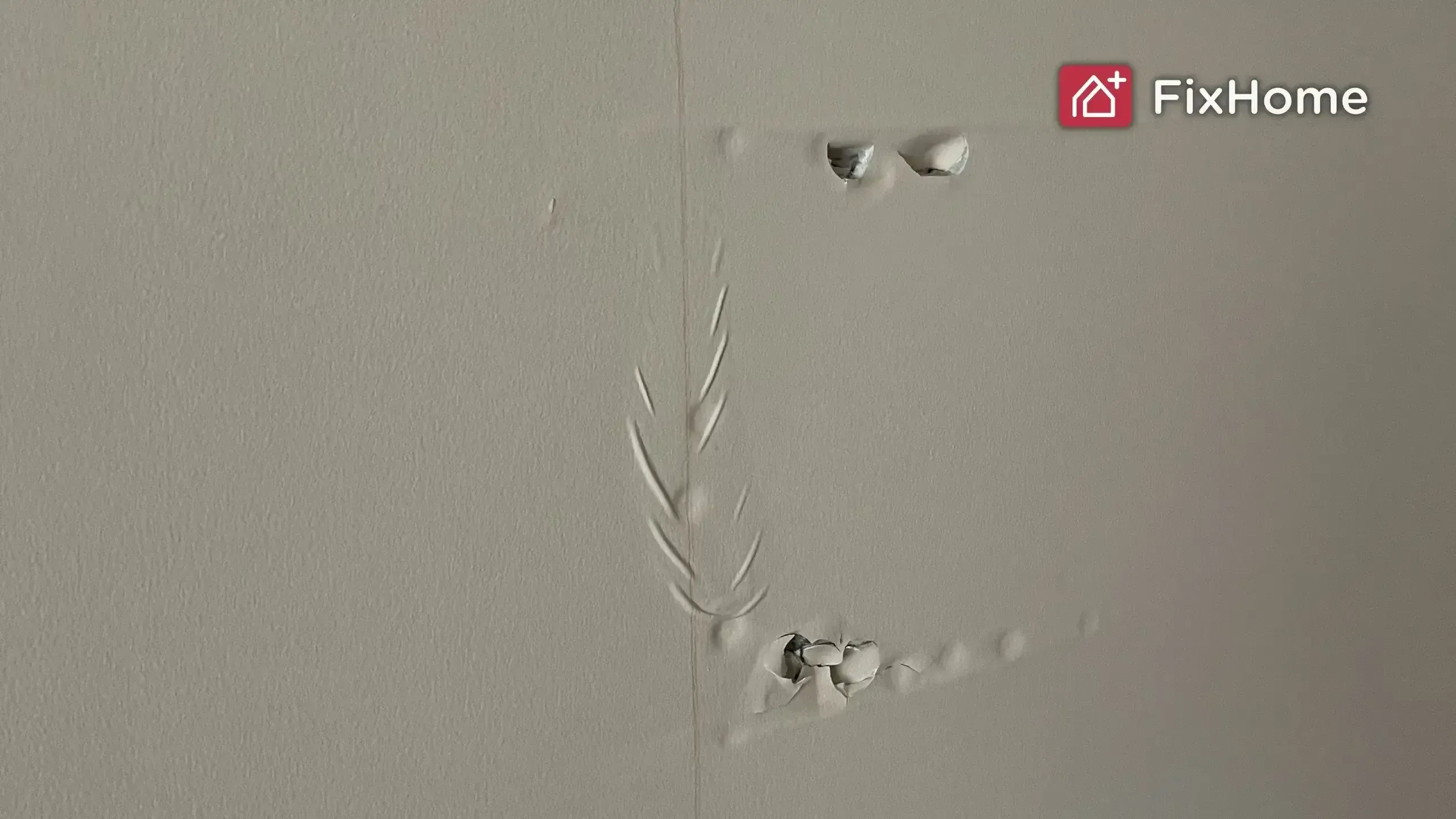 A wall with visible damage after leaking water, including slight dents and peeling paint.