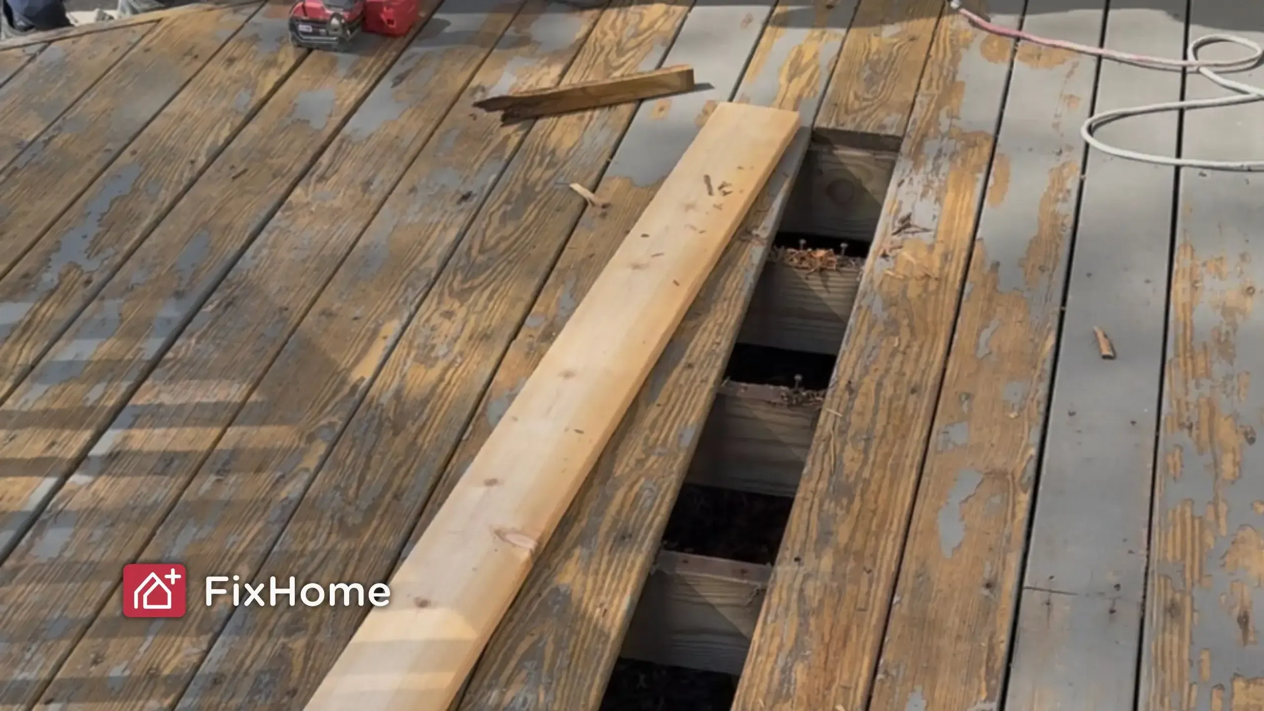 Deck repair replacing rotted boards with new wood plank
