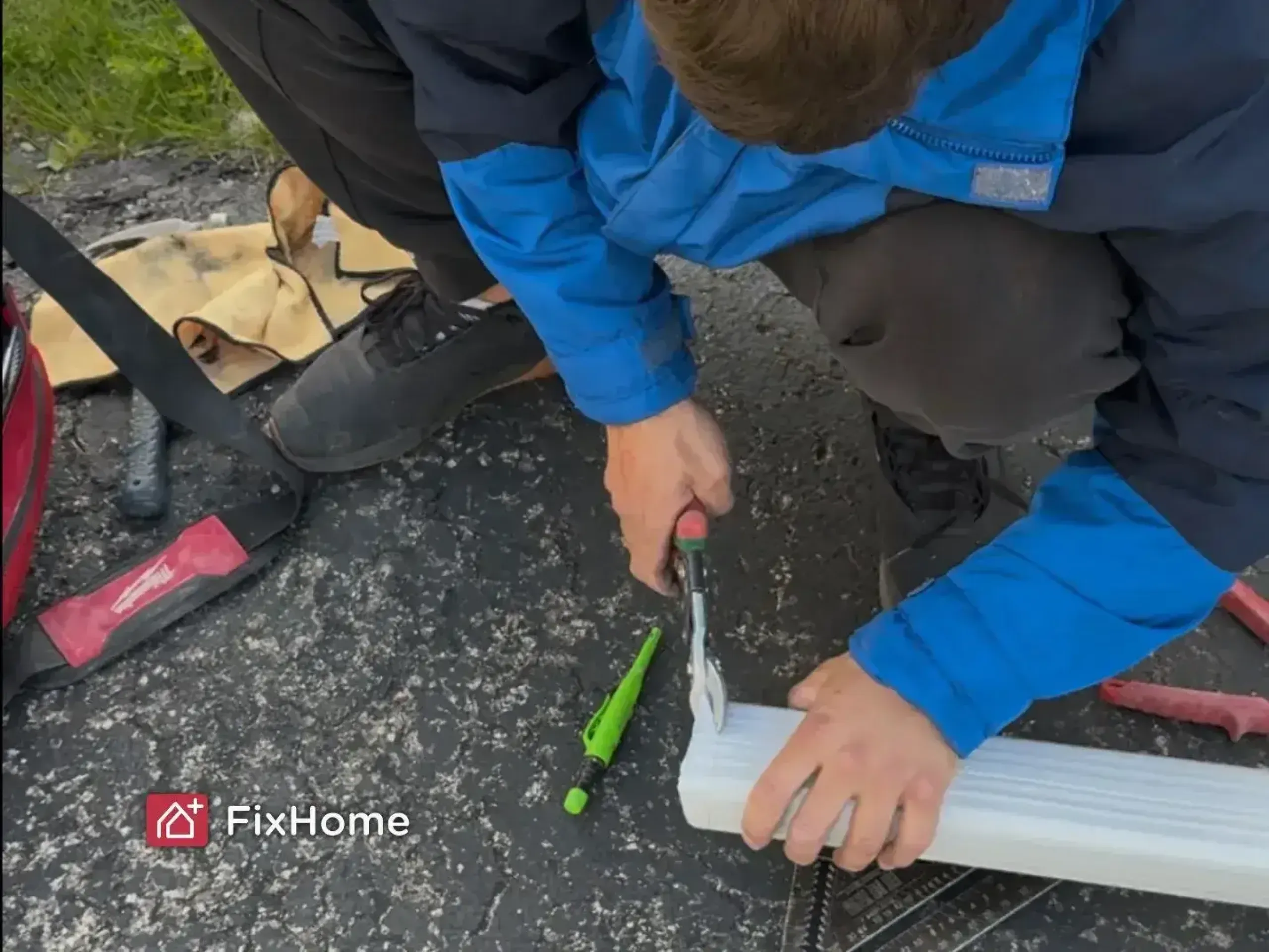 Cutting aluminum downspout pipe with tin snips for custom discharge end