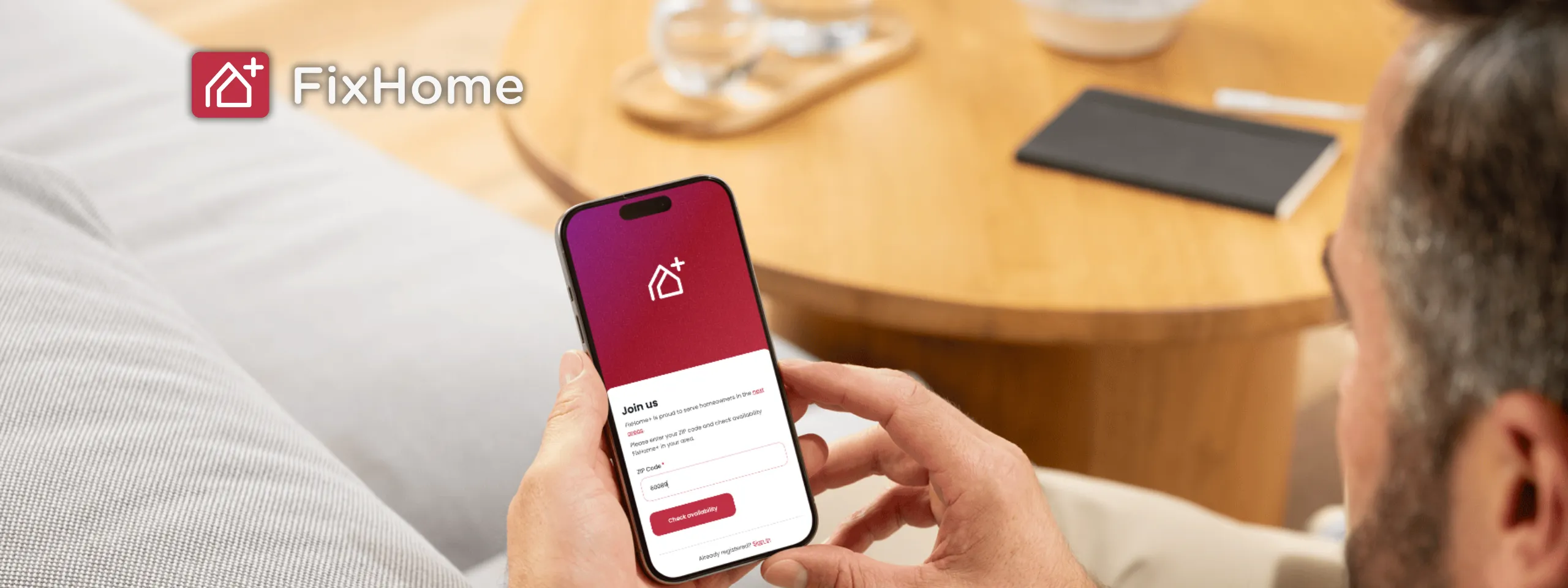 Man with phone using FixHomePlus App 