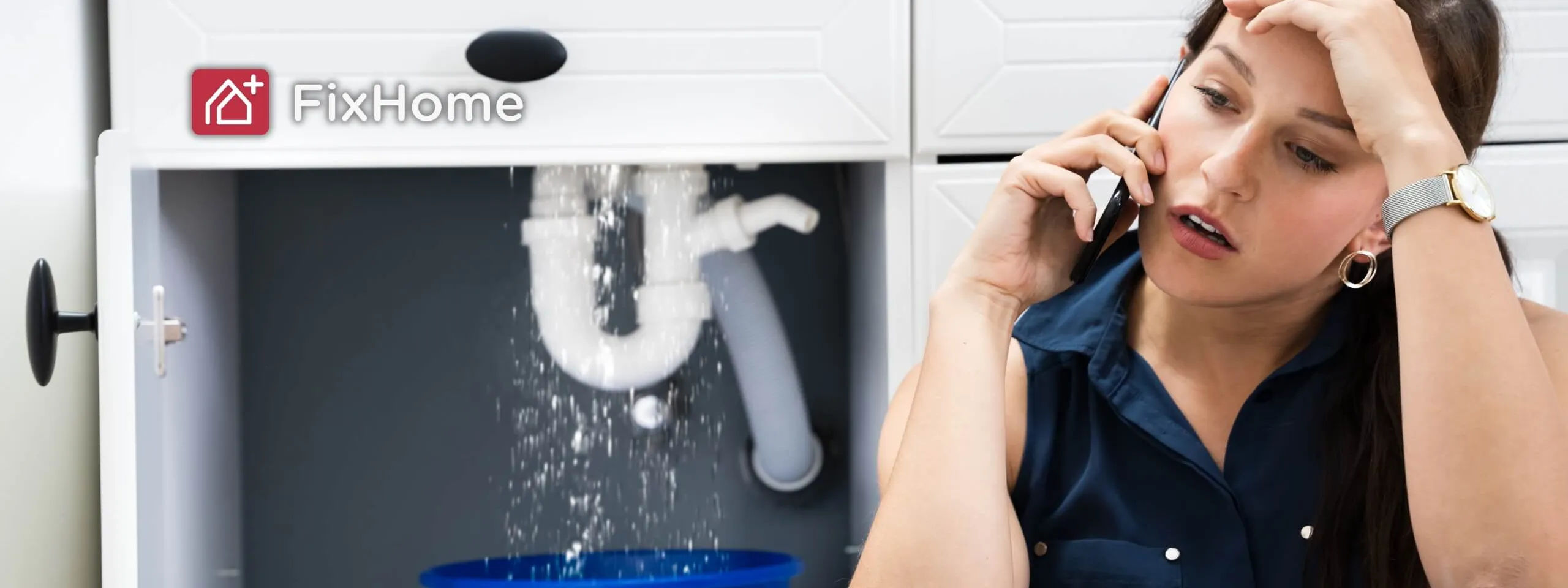 A woman calling the handyman when under sinking pipe leaks