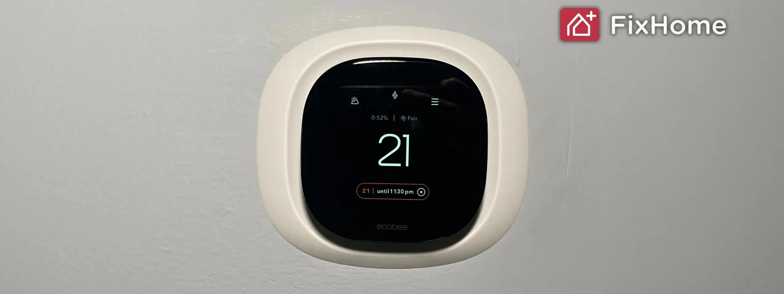 Smart thermostat installing on the white wall