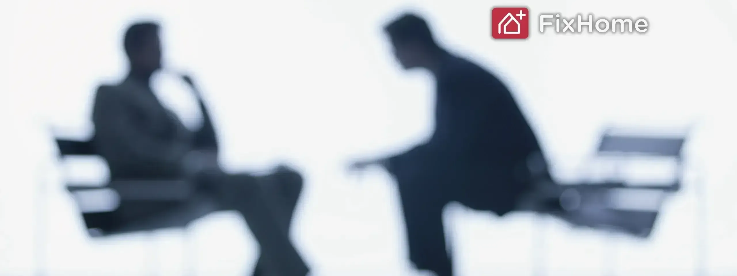 Silhouettes of two people in conversation