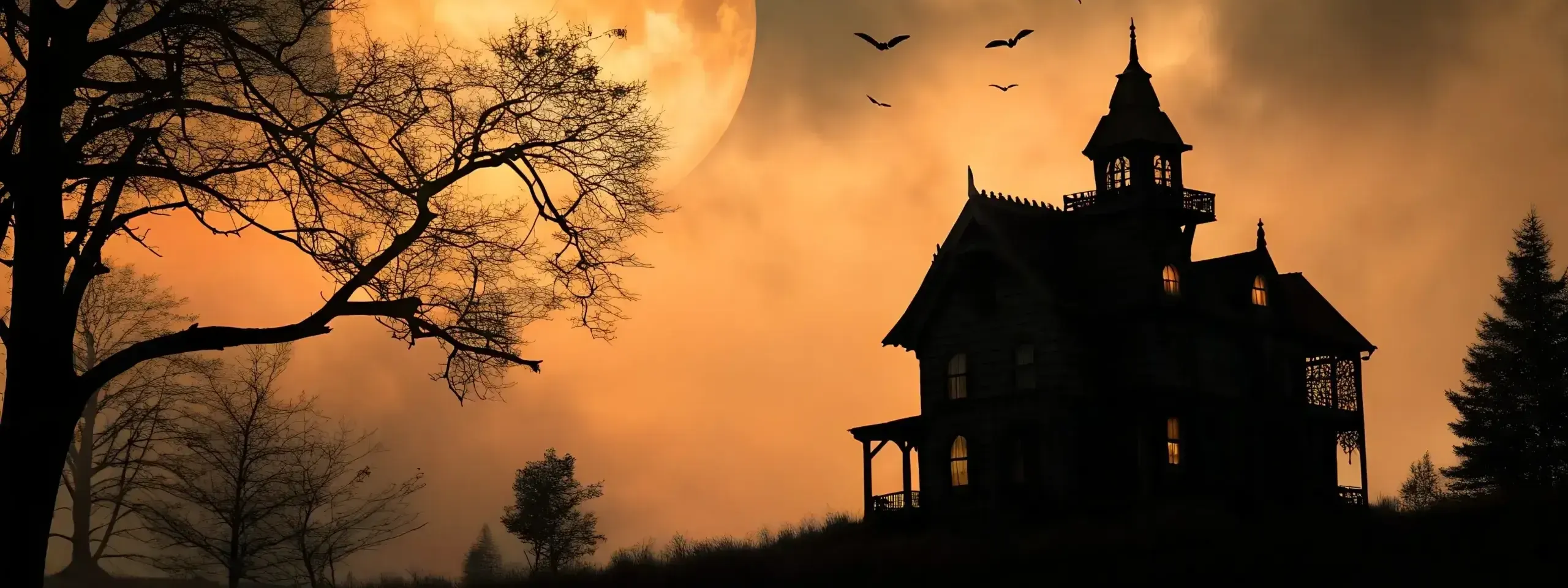 Spooky Silhouette of a Victorian House Under a Large Orange Moon