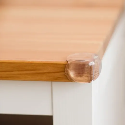 A close up of a wooden counter top with corner guard FixHomePlus