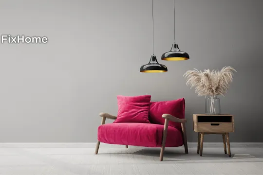 Modern living room with gray walls, red chair, stylish lights