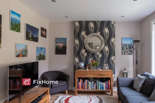 Living room with pictures, mirror and other decor on the wall