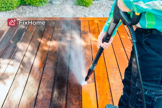 Before-and-after view of a pressure-washed wooden deck