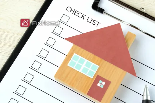 A checklist clipboard with a small house mode