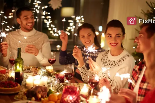 Happy Friends Celebrating Christmas at Home Feast