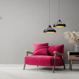 Modern living room with gray walls, red chair, stylish lights