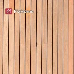 Wooden deck planks arranged in vertical lines, showing a light brown color 