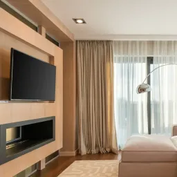 Modern living room with wall-mounted TV in a wooden media unit
