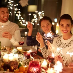 Happy Friends Celebrating Christmas at Home Feast